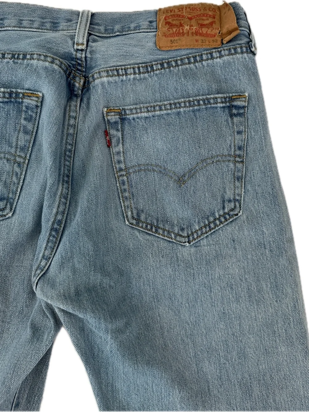 Levi's 501 blue jeans with distressed knees